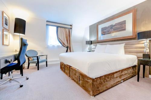 a hotel room with a bed and a desk at The Landmark Hotel and SPA Leisure Club Dundee By Sunday in Dundee