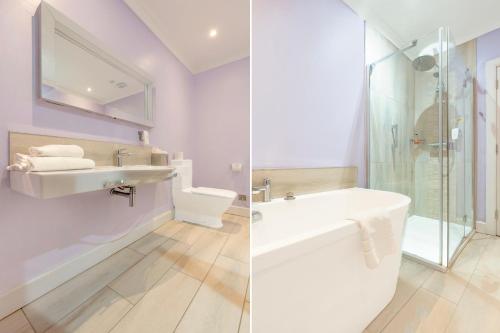a white bathroom with a sink and a shower at The Landmark Hotel and SPA Leisure Club Dundee By Sunday in Dundee