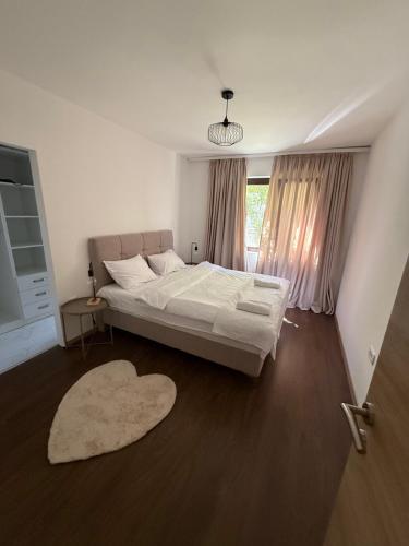 a bedroom with a large bed and a window at Maslina- 3 bedroom apartment in Kotor