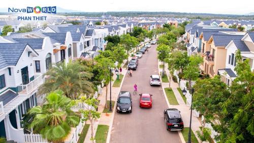 an aerial view of a street with houses and cars at Novaworld Phan Thiết - Luxury villa 3 Phòng Ngủ in Phan Thiet