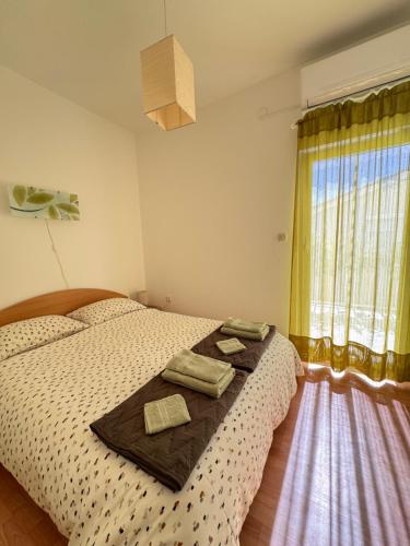 Postel nebo postele na pokoji v ubytování Apartman Mjesec