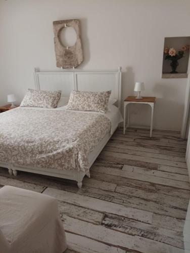 Ένα ή περισσότερα κρεβάτια σε δωμάτιο στο La Puglia di Claudia