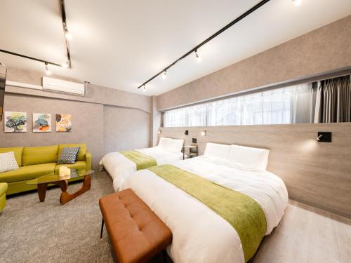 Voodi või voodid majutusasutuse Akihabara Sta 13min, Kanda Sta 10min,Ogawamachi 2min,Hotel Prime Inn Kanda, toas