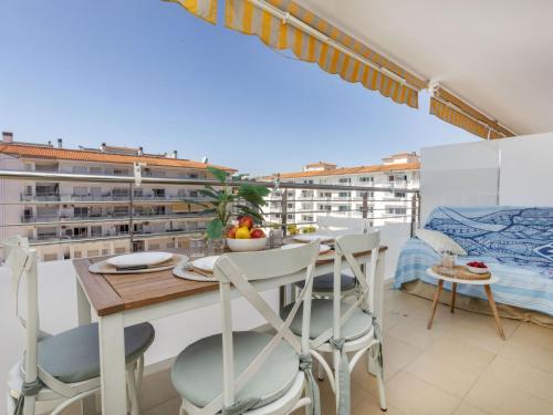 a apartment with a balcony with a table and chairs at Apartment Lotus by Interhome in Blanes