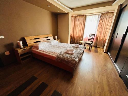 Ένα ή περισσότερα κρεβάτια σε δωμάτιο στο IANIS Apartment