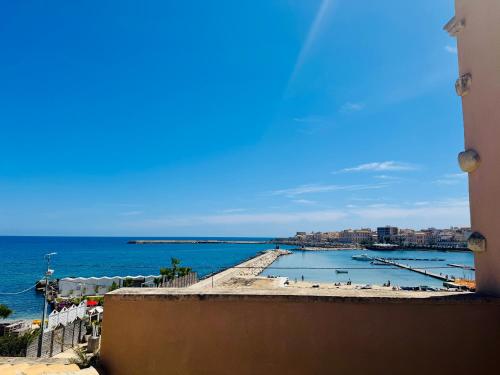 a view of the beach from a building at Riviera del Mare House in Siracusa