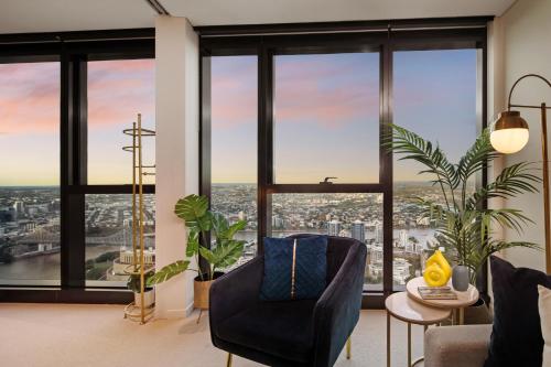 a living room with a view of a city at The Gatsby Escape Skytower Luxury Living at Level 71 in Brisbane