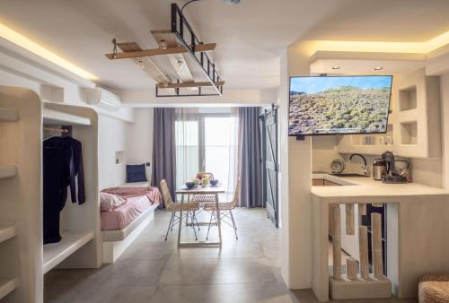 a small apartment with a kitchen and a living room at Sienalice Naxos Next to The Beach in Naxos Chora