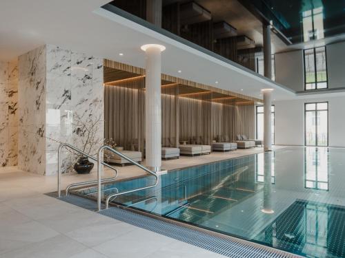 a pool in a building with a swimming pool at Grand Elisabeth in Bad Ischl