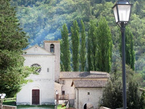 a church with a street light in front of it at Abbazia dei Santi Felice e Mauro in Castel San Felice
