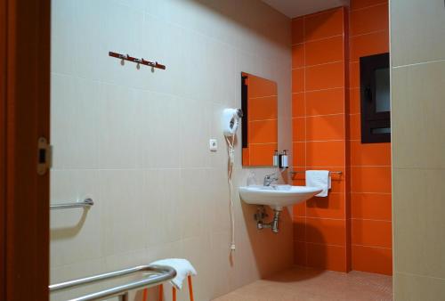 a bathroom with a sink and a mirror at Hotel Villa Ceuti in Ceuti