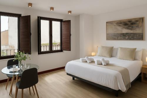 Katil atau katil-katil dalam bilik di Rua Mayor MSuites