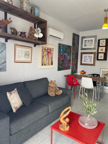 a living room with a couch and a table at Vans 24~400 Meters to Beach in Nea Paphos