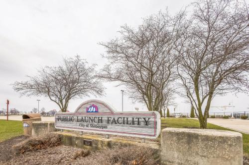 a sign for a harriet harriet facility with trees in the background at Harbor Hideaway - Walk to Beach, Dining & Downtown condo in Sheboygan