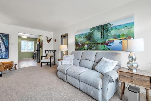 a living room with a couch and a table at Harbor Hideaway - Walk to Beach, Dining & Downtown condo in Sheboygan