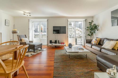 a living room with a couch and a table at LV Premier Apartments Chiado- CH in Lisbon