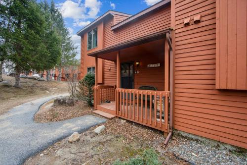a home with a red house with a porch at Lower Darby in North Creek