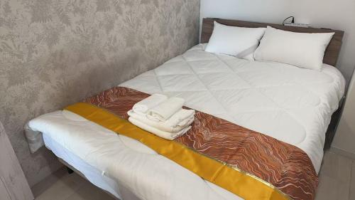 Postel nebo postele na pokoji v ubytování 新宿区短期賃貸c