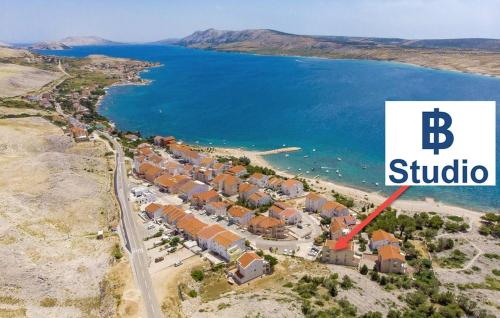 an aerial view of a resort next to a body of water at Apartment IB Studio Pag6 in Kustići
