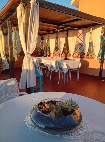 a table with a bowl of food on top of it at Belli come il Sole in Serri