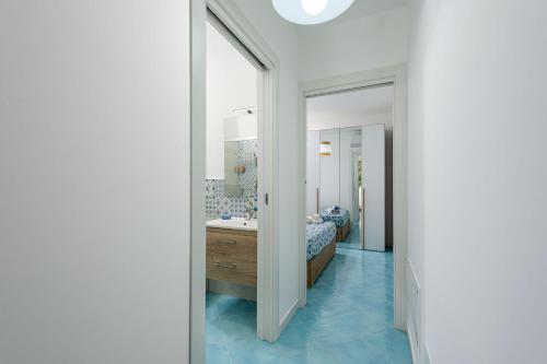a bathroom with a sink and a mirror at Kasbah Levante & Ponente in San Vito lo Capo