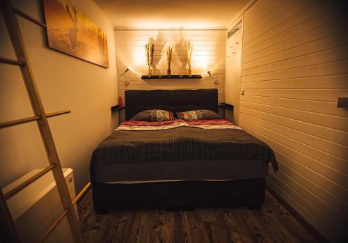 a bedroom with a bed in a small room at Natur tanken im Schwarzwald in Sasbachwalden