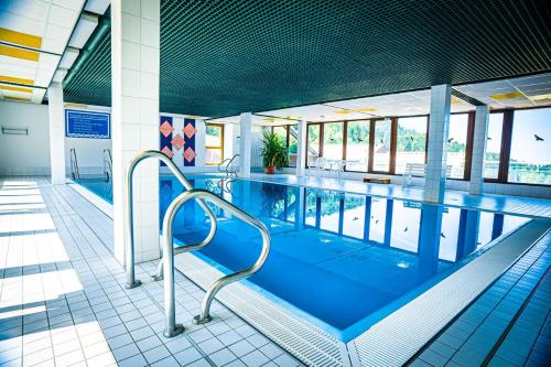 a large swimming pool in a building at Natur tanken im Schwarzwald in Sasbachwalden
