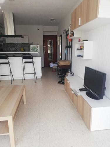 Photo de la galerie de l'établissement Bright apartment with garden near the sea, au Grau-du-Roi