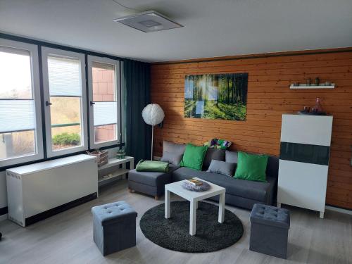 a living room with a couch and a table at Schwarzwald Pur in Sasbachwalden