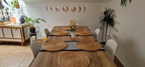a dining room table with hats on top of it at Casa D’Amelia in Ojén