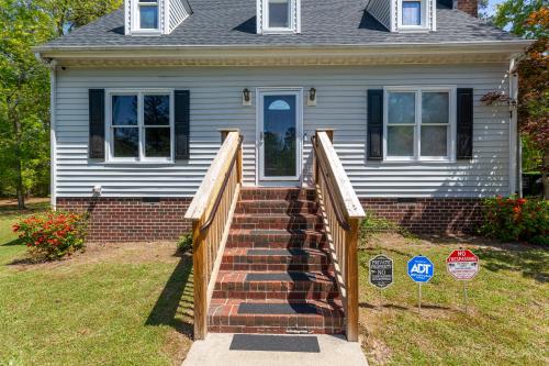 a house with a staircase in front of a house at Serenity Haven in Lillington