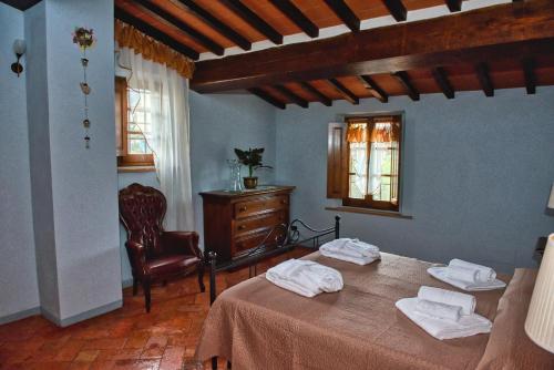 Ένα ή περισσότερα κρεβάτια σε δωμάτιο στο Niccoli's Holiday Home In Tuscany