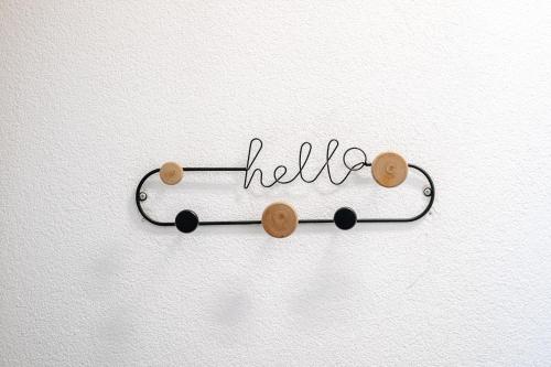 a sign that says hello on a white wall at WagnerStays BadEms Historic VillaWhirpool Billiard in Bad Ems