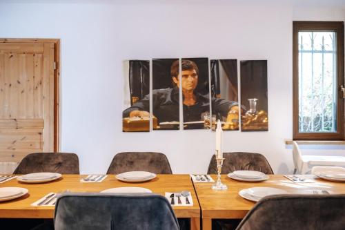 a dining room with a wooden table and chairs at WagnerStays BadEms Historic VillaWhirpool Billiard in Bad Ems