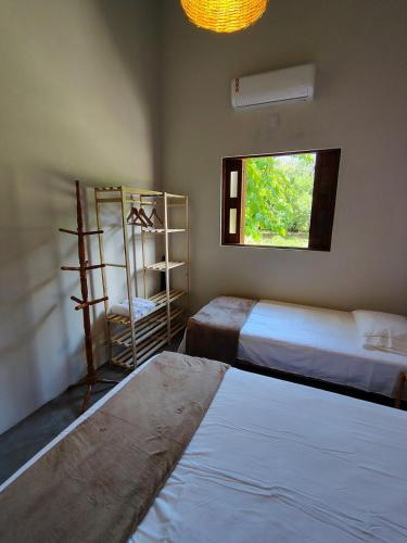 Ένα ή περισσότερα κρεβάτια σε δωμάτιο στο Casa Cajá - Boipeba