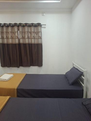 Postel nebo postele na pokoji v ubytování Jayshree Cottages