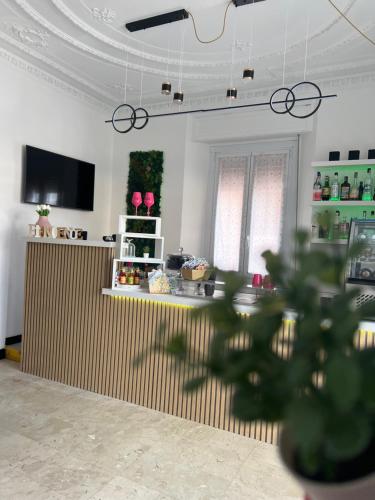 TV a/nebo společenská místnost v ubytování Hotel & Garden
