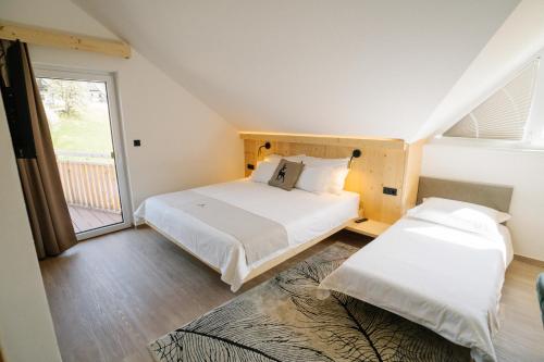 Cama o camas de una habitación en Sobe rooms JELEN JELENOV GREBEN