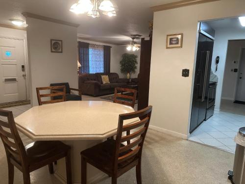 a kitchen and living room with a table and chairs at Vacation home in Melbourne