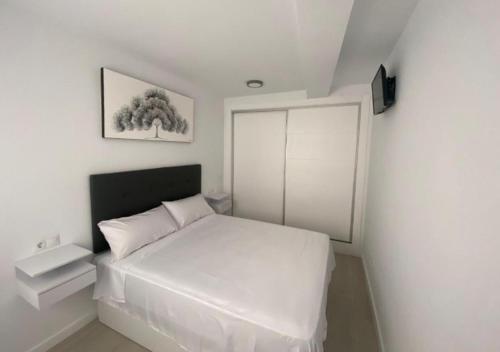 Postel nebo postele na pokoji v ubytování Apartamento isabel, alojamiento con entradas al Caminito del Rey