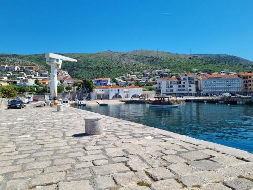 a view of a harbor with a town and water at Bruno 1 in Senj