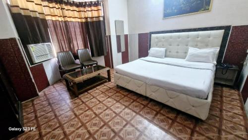 Ένα ή περισσότερα κρεβάτια σε δωμάτιο στο Hotel Asia Palace