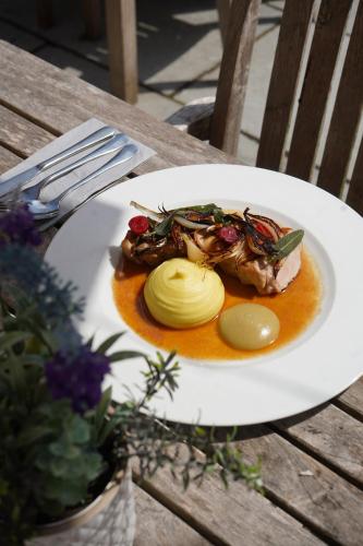 a plate of food on a wooden table at The Boot Inn in Burton upon Trent