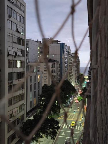 a view of a city street with tall buildings at 5 min da Praia! 2 Quartos Copacabana in Rio de Janeiro