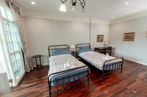 Postel nebo postele na pokoji v ubytování Hacienda Home