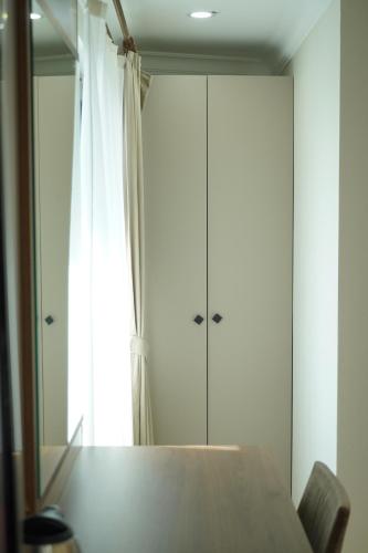 a bedroom with a bed and a large mirror at Lioncity Hotel in Bursa