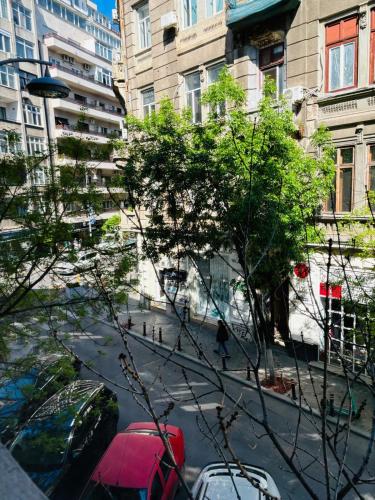a view of a city street with cars and buildings at Iancu Apartments in Bucharest