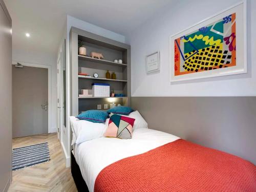 a bedroom with two beds and a painting on the wall at Cork Street in Dublin in Dublin