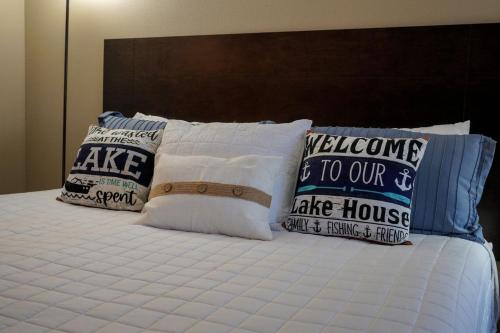 a bed with pillows on top of it at The Perch at Kimberling Crossing in Kimberling City