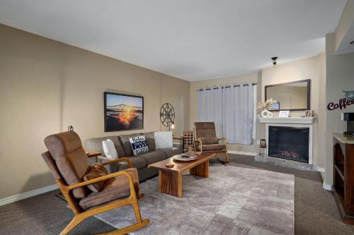 a living room with a couch and a fireplace at The Perch at Kimberling Crossing in Kimberling City